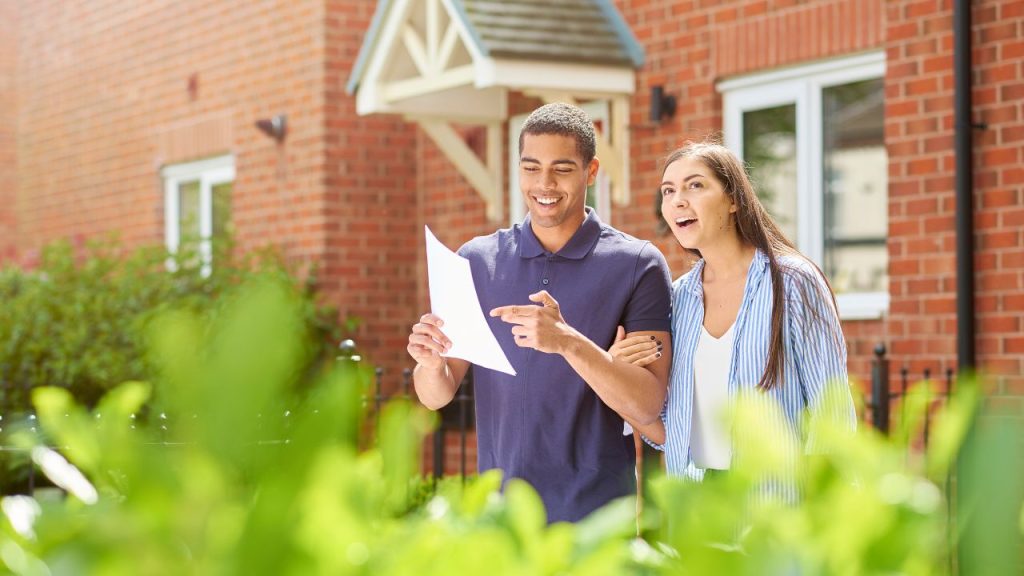A Couple Checking Checklist for First-Time Home buyers